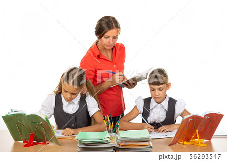 The teacher checks how students cope with the 56293547