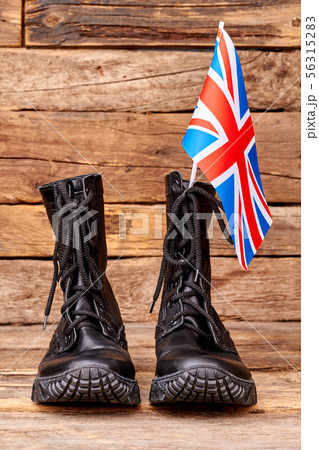 Pair of black combat boots with britain flag. 56315283