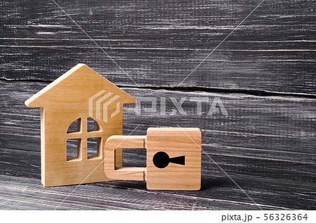 Wooden house with a padlock. House with a lock. Wooden house with a padlock. House with a lock. 56326364