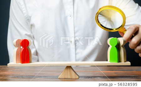 A man with a magnifying glass is looking 56328595