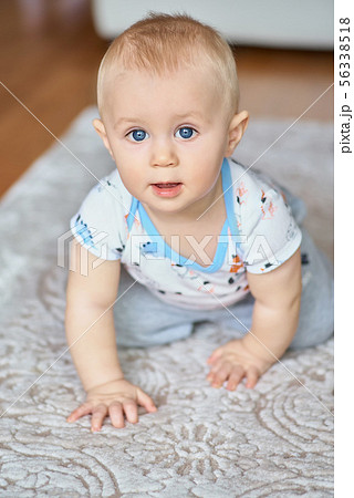 Adorable smiling little boy with big blue eyes 56338518