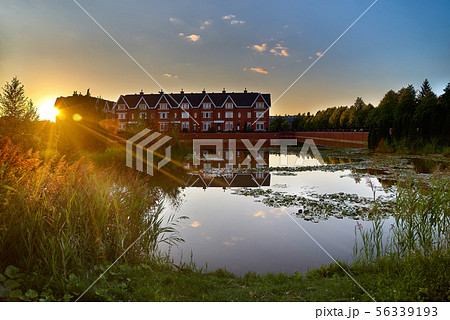 Beautiful sunset over the lake. Public park Beautiful sunset over the lake. Public park 56339193