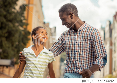 Joyful young man embracing his cute daughter 56356692