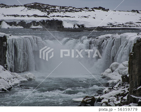 Snow and ice at the Dettifoss Waterfall in Iceland Snow and ice at the Dettifoss Waterfall in Iceland 56359779