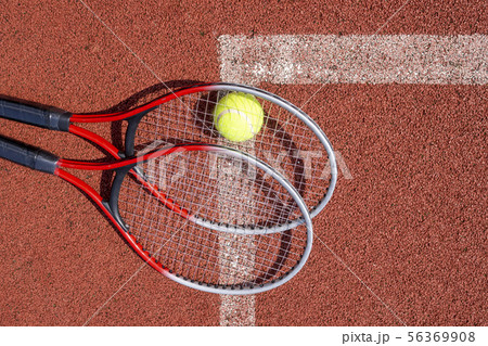 Top view tennis scene with ball and racquet Top view tennis scene with ball and racquet 56369908