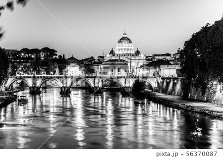 St Peters Basilica in Vatican and Ponte Sant'Angelo Bridge over Tiber River at dusk. Romantic 56370087