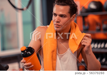 Attractive fit man sweating after the workout Attractive fit man sweating after the workout 56370260