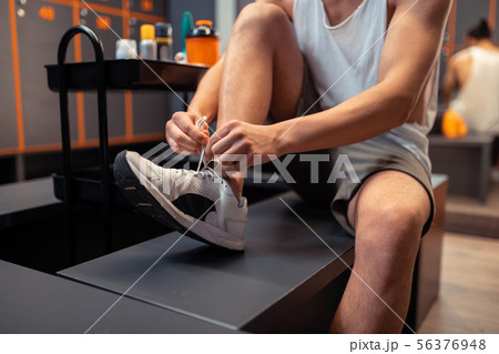 Close up of a male shoe being laced 56376948