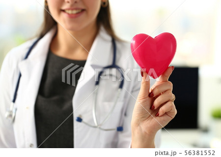 Beautiful smiling blond female doctor hold Beautiful smiling blond female doctor hold 56381552