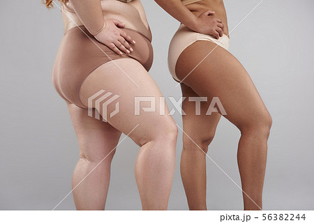 Premium Photo  Cropped of overweight fat woman holding tummy