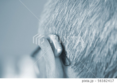 Man with hearing aid Man with hearing aid 56382417