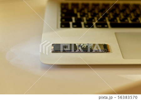Chip SSD drive on laptop in soft beam light. 56383570