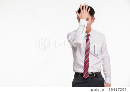 Asian businessman standing and puts hand on head.. Asian businessman standing and puts hand on head.. 56417295