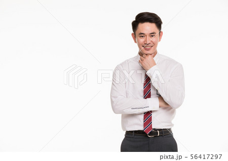 Asian businessman putting his hand under his Asian businessman putting his hand under his 56417297