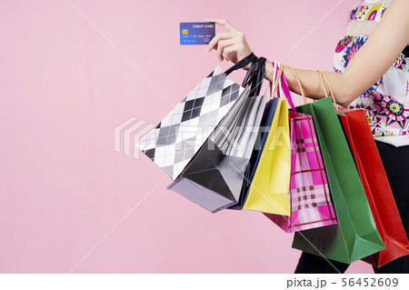 Closeup of woman hand holding credit card and 56452609