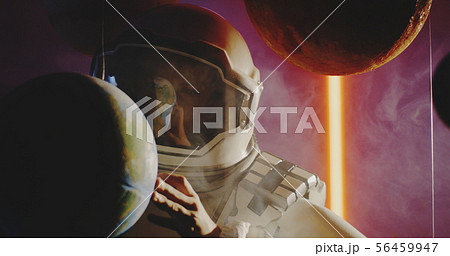 Student in space suit revolving planet model Student in space suit revolving planet model 56459947