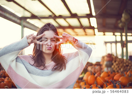 Fashionable beautiful young girl at the autumn 56464083