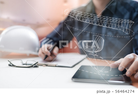 Young blurred sub-designer sitting in the office Young blurred sub-designer sitting in the office 56464274