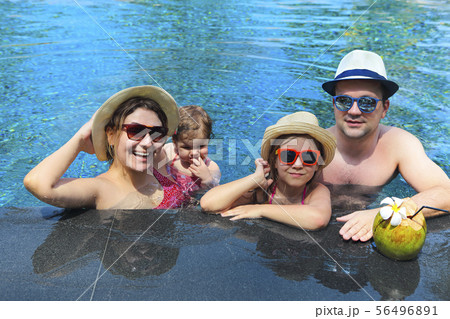 Happy young family with little kids having fun Happy young family with little kids having fun 56496891