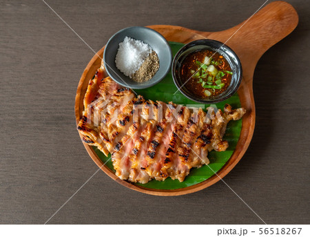 Grilled beef steak with spicy sauce 56518267