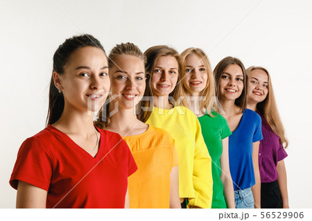 Young women weared in LGBT flag colors isolated on white background, LGBT pride concept 56529906