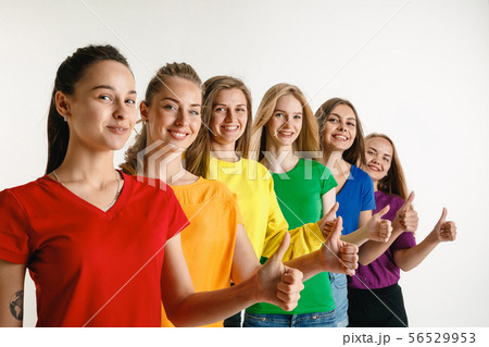 Young women weared in LGBT flag colors isolated on white background, LGBT pride concept Young women weared in LGBT flag colors isolated on white background, LGBT pride concept 56529953