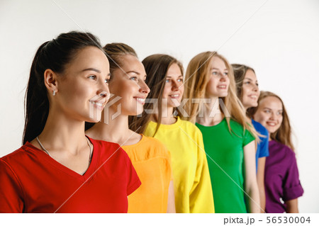 Young women weared in LGBT flag colors isolated on white background, LGBT pride concept Young women weared in LGBT flag colors isolated on white background, LGBT pride concept 56530004