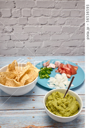 view of a bowl with spicy guacamole next to a bowl view of a bowl with spicy guacamole next to a bowl 56536593