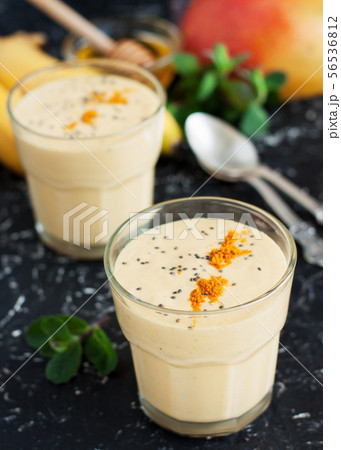Smoothie with tropical fruits and turmeric Smoothie with tropical fruits and turmeric 56536812