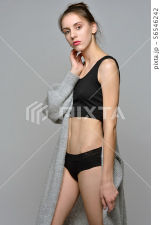 beautiful woman in black underwear and grey beautiful woman in black underwear and grey 56546242