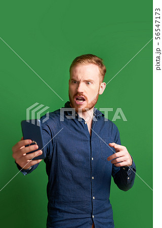 Angry man reading notification 56547173