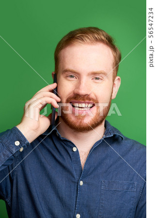Irish young man making phone call 56547234