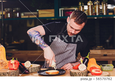 Chef making healthy vegetarian salmon burgers outdoor on open kitchen, odprta kuhna, international Chef making healthy vegetarian salmon burgers outdoor on open kitchen, odprta kuhna, international 56570762