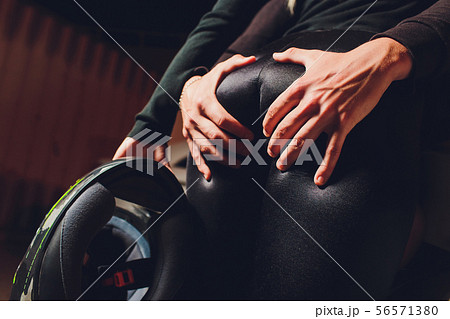 Young girl in leather jacket and leggings sitting on motorcycle, seductive slim biker girl with Young girl in leather jacket and leggings sitting on motorcycle, seductive slim biker girl with 56571380