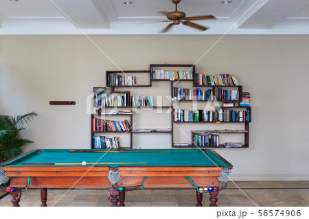 Pool table and bookshelf on white background. 56574906
