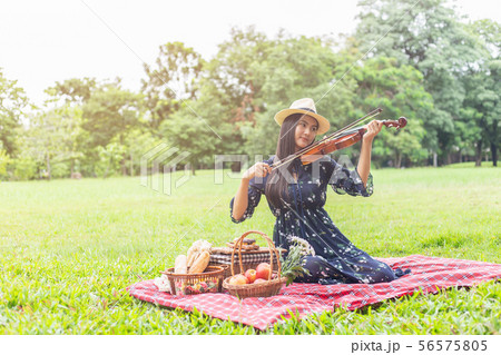 beautiful young women playing the violin in beautiful young women playing the violin in 56575805
