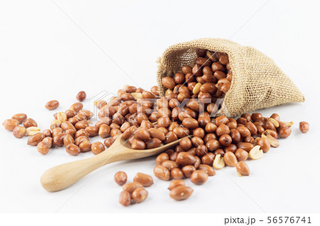 peanut pour out small sack with wooden spoon on 56576741