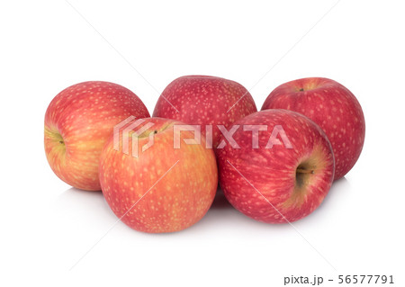 写真素材: pile of pink lady apple isolated on wh