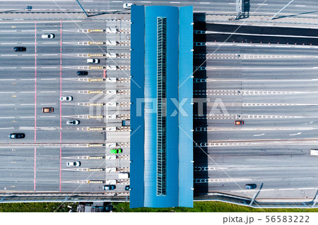 Toll roads on the broad highway. Through the point passes a large number of trucks and cars. Top 56583222