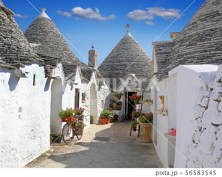 Traditional Apulian Trulli houses. Apulia, Italy Traditional Apulian Trulli houses. Apulia, Italy 56583545