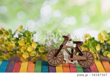 Bicycle wood model place on the colorful wooden Bicycle wood model place on the colorful wooden 56587307