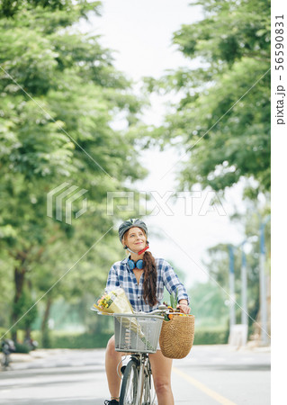 Happy woman riding bicycle 56590831