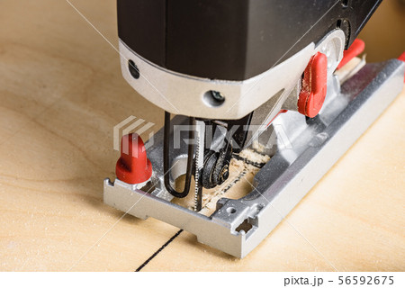 Jig saw cutting plywood 56592675