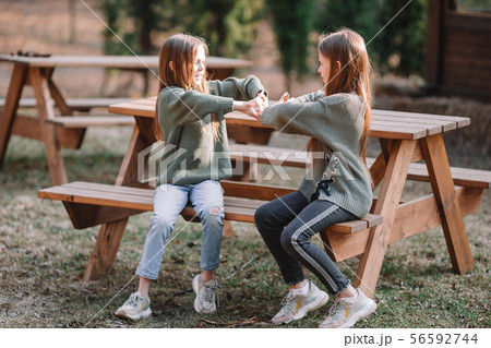 Little girls in outdoor park on her weekend 56592744