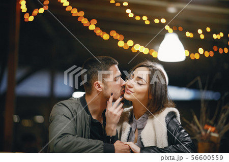 couple kissing in the restaurant couple kissing in the restaurant 56600559