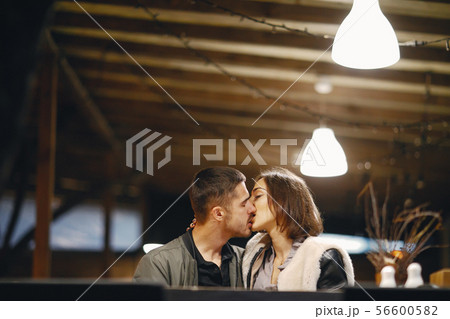 couple kissing in the restaurant couple kissing in the restaurant 56600582