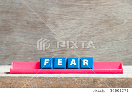 Tile letter on red rack in word fear Tile letter on red rack in word fear 56601271