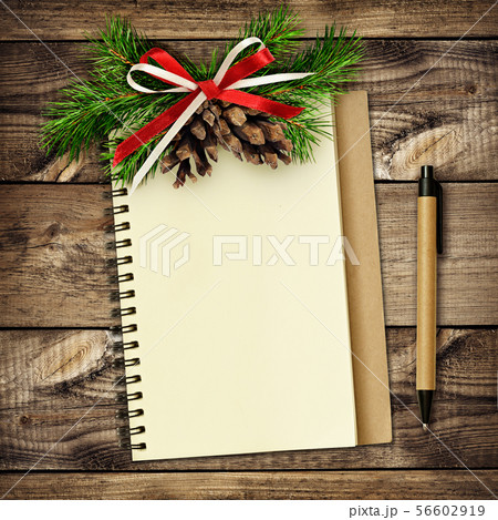 Notebook and pen with Christmas decorations on 56602919