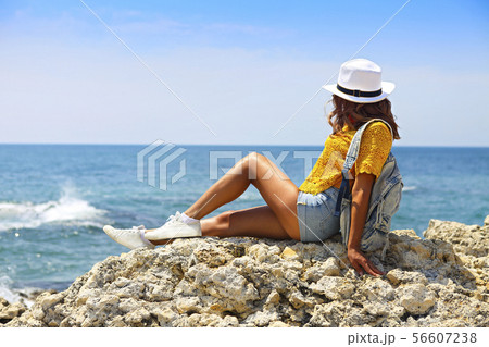 Female tourist wanderlust with backpack wearing Female tourist wanderlust with backpack wearing 56607238