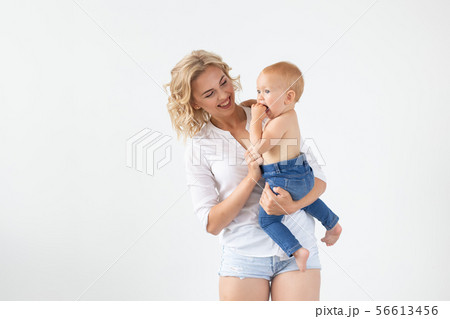 Happy mother with adorable baby on white background Happy mother with adorable baby on white background 56613456